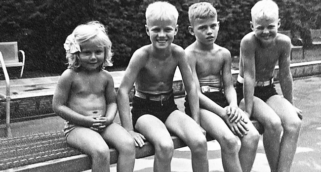 Marty (right) and Siblings sitting on diving board at Trenton Country Club