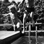Marty and sister, Trish jumping into the pool