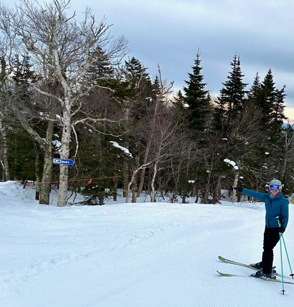 skier pointing to closed ski run